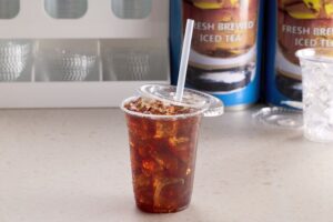 Mango-Pineapple Iced Tea in a Plastic Cup